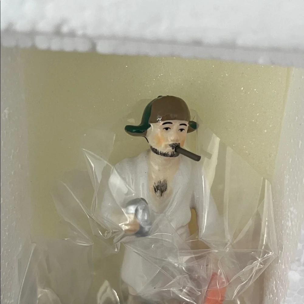 Department 56 Christmas Vacation Cousin Eddie Figurine in White and Orange